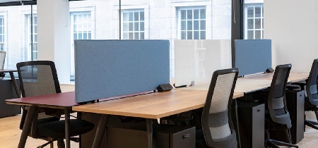 Office desks and chairs set up in an open office