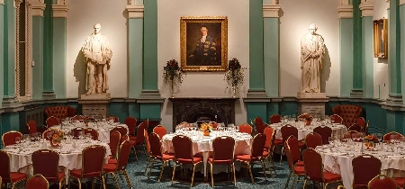Dining tables set up in a carpeted room