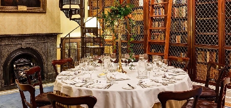 A formal dining table set up for eight diners